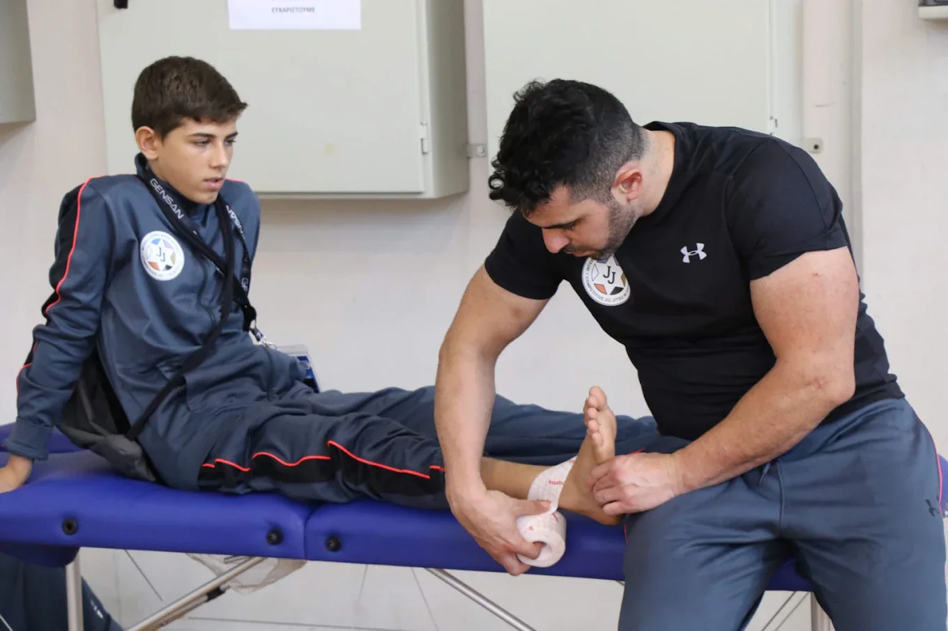 Gilad working with a young client in the clinic